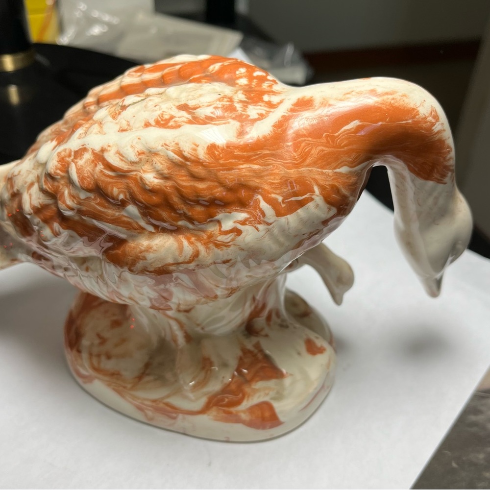 Figurine of duck/goose and baby.
